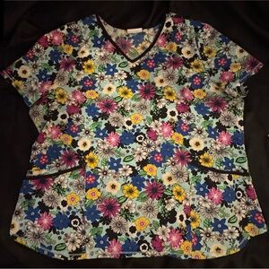 Women's Floral Stretchy Scrub Top with Black Trim.